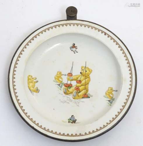 An early to mid 20thC Child's ceramic plate, decorated with illustrations of bears and dolls, with