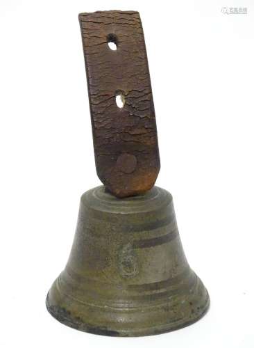 A butlers bell numbered '6' with part leather strap . The bell 2 1/2