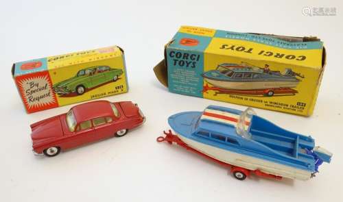 Toys: Two die cast scale model boat and car Corgi Toys to include a Dolphin 20 Cruiser on Wincheon