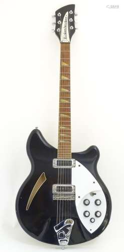 Musical Instrument: a Rickenbacker model 360 hollowbody electric guitar, in 'Jetglow' black