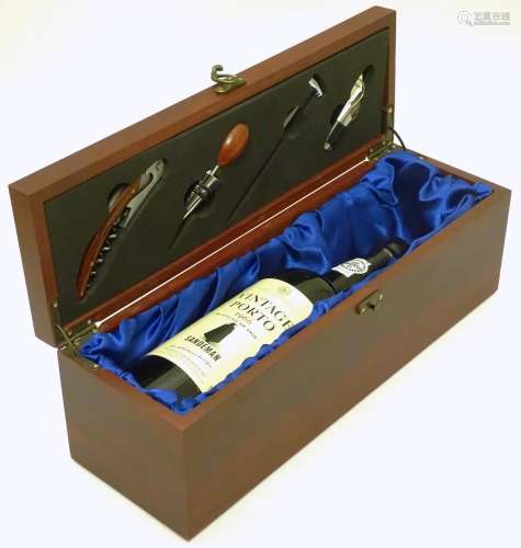 A 75cl bottle Sandemans vintage 1966 port, in presentation case, the lid inset with barman's