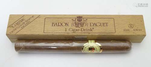 A novelty cased 20ml cognac decanter formed as a cigar, cased, with label for Baron Daguet. 6 1/2