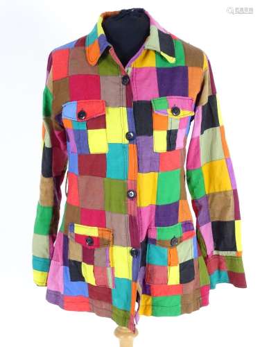 A vintage multi coloured patchwork blouse/shirt with patch pockets and belt loop. Bust size 32