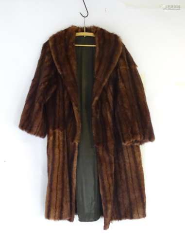 A knee length fur coat. Bust size 46