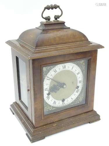 A 20thC Smiths walnut cased bracket clock in walnut case with silvered Roman chapter ring , hammered