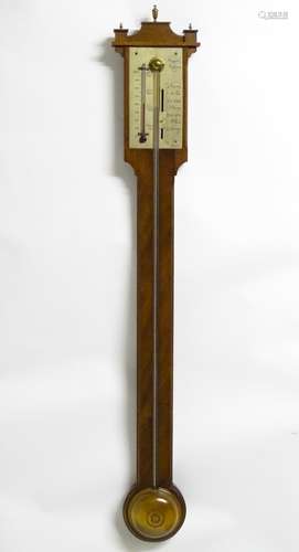 A mid 20thC stick barometer, the plate marked ' Comitti, Holborn', mahogany case with brass finials.