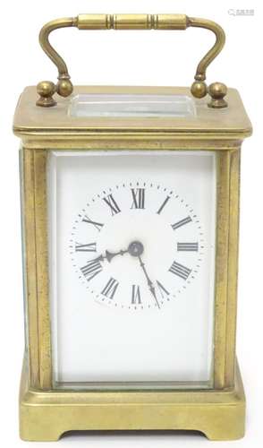 A 20thC brass cased carriage clock / timepiece . 5 1/2