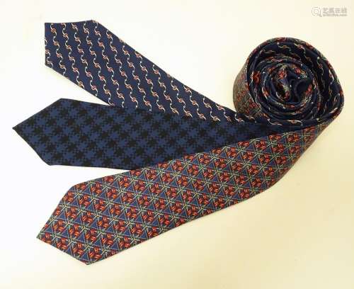 3 Hermes silk navy and red ties, of various designs (3) Please Note - we do not make reference to