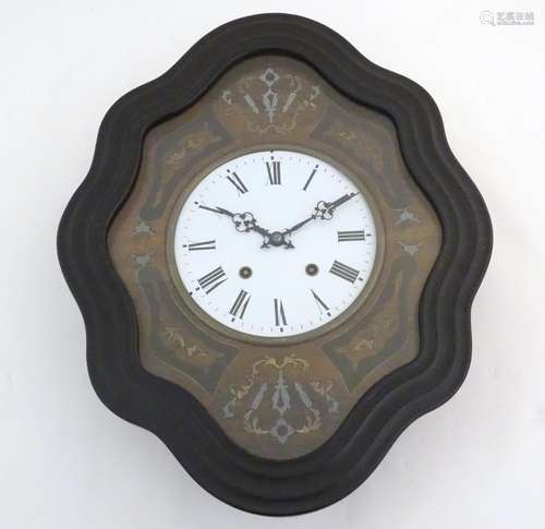 A 19thC French vineyard wall clock, the ebonised case with glazed panel over ebony, brass and