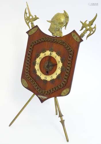 A late Victorian strut mantle clock, the brass stand formed as crossed halberd and helm,