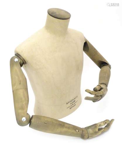 A Stockman Paris mannequin, with turned hardwood articulated limbs, 22