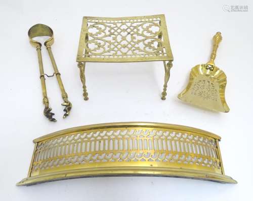 An assortment of Victorian brass fire / stove tools, comprising short tongs and shovel, trivet and
