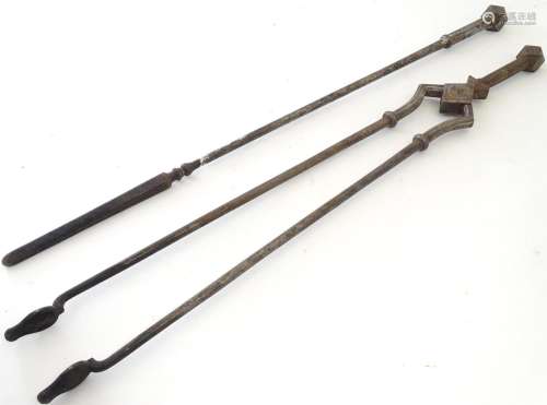 A pair of 19thC Gothic Revival wrought iron fire tools, comprising tongs and poker, each having