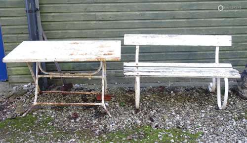 A Victorian garden bench with wrought iron mounts and wooden slatted seat, white painted finish,