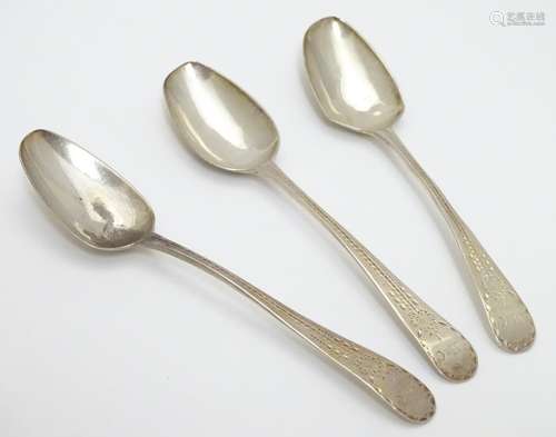 A set of three William IV silver teaspoons with bright cut decoration to handles. Hallmarked 1832