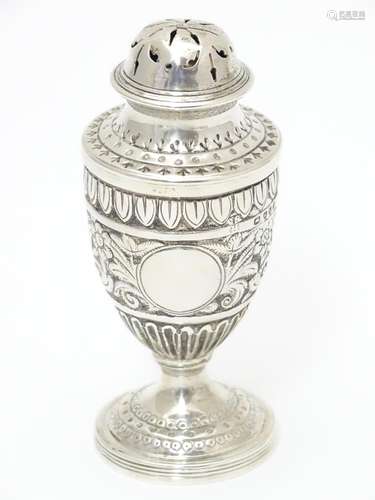 A Victorian silver caster / pepperette hallmarked London1886 maker Charles Stuart Harri. Approx 3