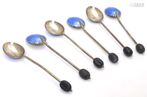 A cased set of six silver and enamel coffee bean spoons, the handles with coffee beans decoration,