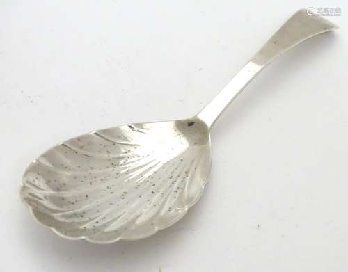 A 19thC silver shell formed caddy spoon. Hallmarked London 1820 maker Thomas Wilkes Barker. 4