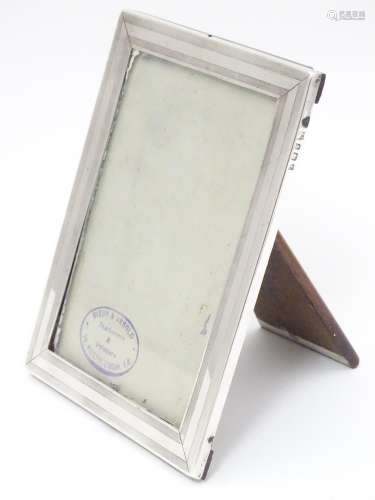 A photograph frame with silver surround hallmarked Birmingham 1918 maker William Neale & Son Ltd. 6