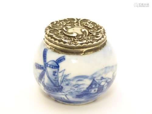 An early 20thC ceramic pot with Dutch landscape decoration and silver lid hallmarked London c.
