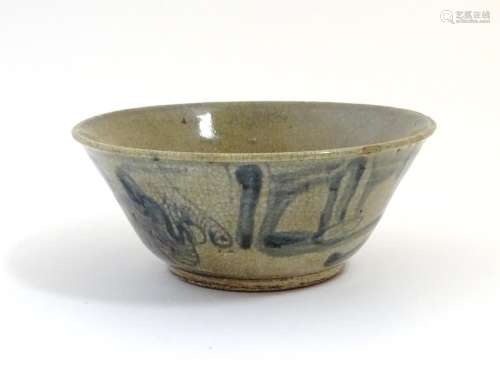 A Chinese crackle glaze bowl with blue brushwork detail. Approx. 3 3/4