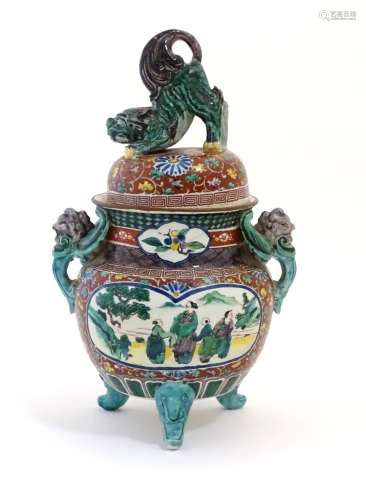 A Chinese pot and cover of koro form, the cover surmounted by a foo dog. The body decorated with a