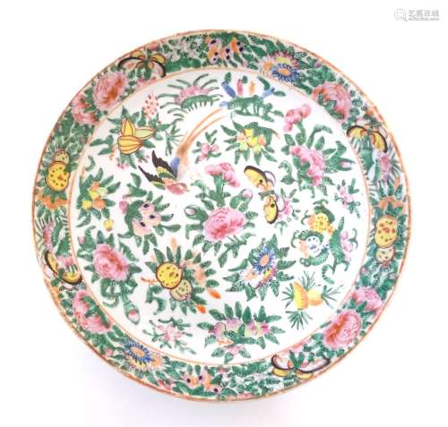 A Chinese Cantonese plate / dish decorated with birds, butterflies, flowers and foliage. Approx. 9