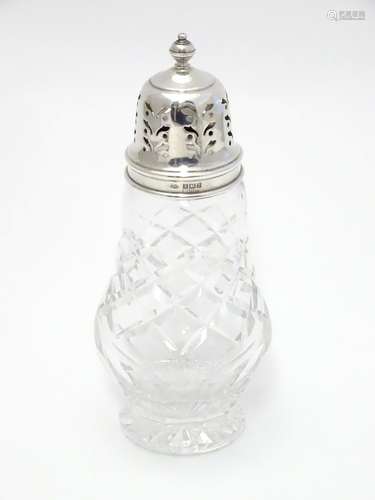 A silver mounted cut glass sugar sifter. Hallmarked Birmingham 1960 maker Adie Bros Ltd. 6