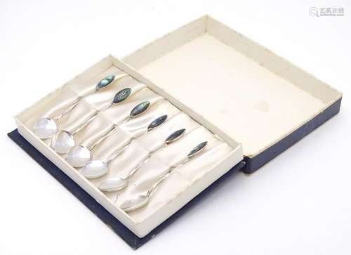 A cased set of 6 New Zealand silver teaspoons with abalone / paua shell decoration to handles.