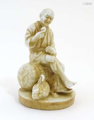 An Oriental figure modelled as a seated man holding an egg with a chicken by his feet. Impressed