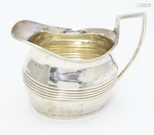 A Victorian silver cream jug hallmarked Birmingham 1893. Approx 3