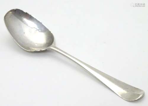 A Geo III Hanoverian spoon with fancy / picture back scallop shell motif. Maker T.W. Approx 4 1/4