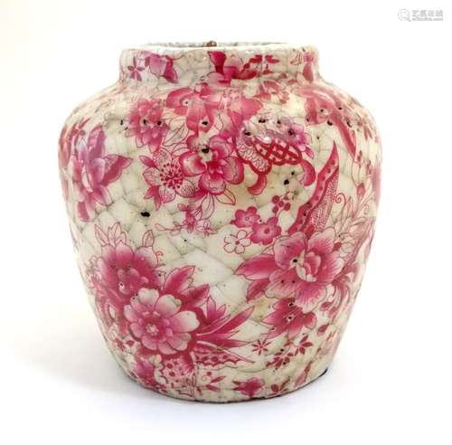 A Continental squat vase with a pink flower and foliate detail and a crackle glaze. Approx. 5 3/4