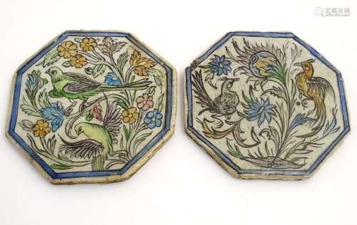 Two Persian tiles of octagonal form decorated with stylised birds and flowers within a blue