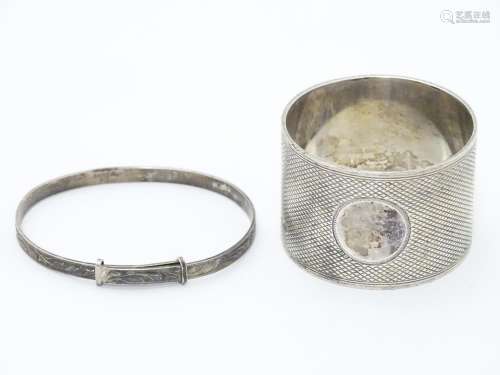 An Art Deco silver napkin ring with engine turned decoration. Hallmarked Sheffield 1933 maker Thomas