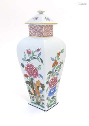 A Portuguese Vista Alegre lidded vase with hand painted floral decoration. Approx. 10 1/4