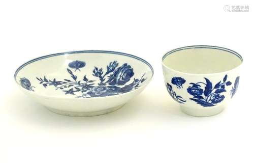 A Worcester blue and white cup and saucer in the pattern Three Flowers. Marked under with crescent