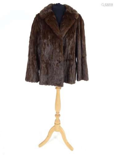 A vintage short length fur coat. Bust size 38