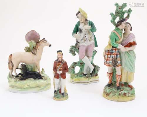 Three assorted Staffordshire figures, comprising a bud vase with horse and foal, a highland couple