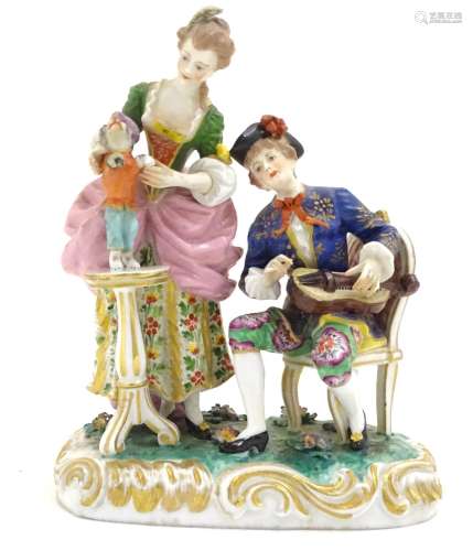 A Continental porcelain figural group depicting a seated man playing a musical instrument and a lady