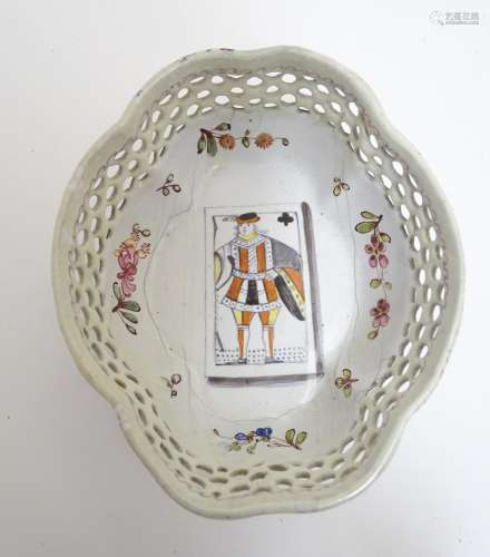 A Battersea enamel style porcelain quartrefoil formed sweetmeat dish with reticulated sides with