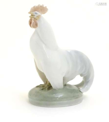 A Royal Copenhagen porcelain model of standing Cockerel. Marked under. Approx. 4 1/4
