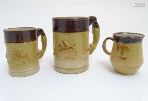 Three Denby two tone stoneware tankards / mugs, two with relief hunting scenes and handles formed as