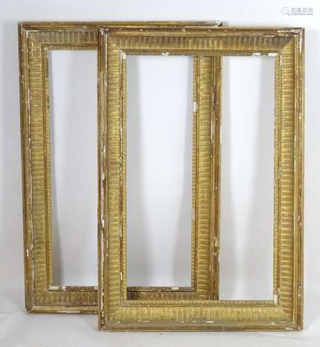 A pair of gilt and gesso moulded picture frames. Approx. 39 1/4