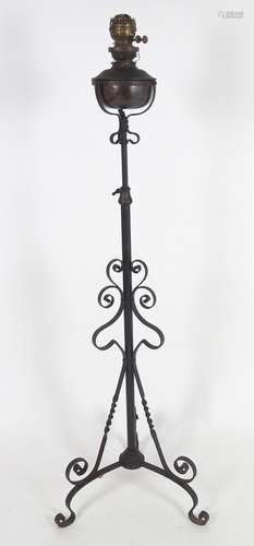 A wrought Iron telescopic oil lamp with tripod legs. 58