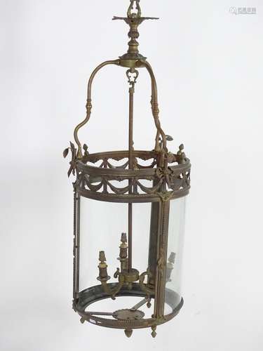 A 19thC brass and copper pendant light of cylindrical lantern form with ribbon and swag detail and