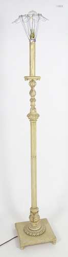 A carved and painted wooded standard lamp with reeded column on a squared base. Approx 60