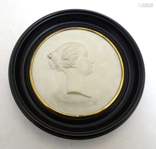 A French 19thC Sevres bisque porcelain / parian ware medallion depicting a profile portrait bust