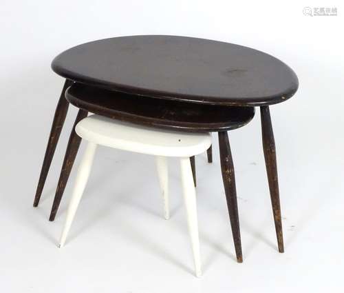 Vintage Retro, Mid Century: an Ercol nest of 'Mushroom' tables, of elm and beech construction, one