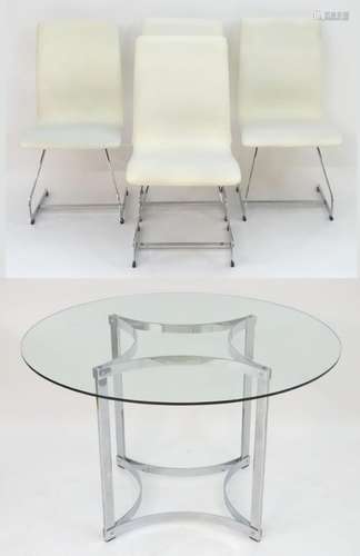 A mid / late 20thC glass top table with a chromed base and four cantilever dining chairs with